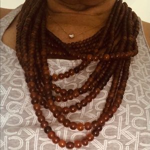 Tortoise shell color multi strand necklace.
